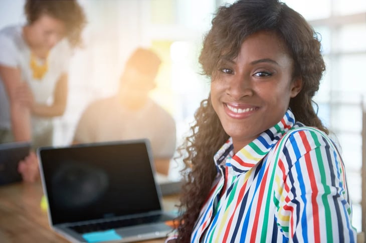 Image of a succesful casual business woman using laptop during meeting-1