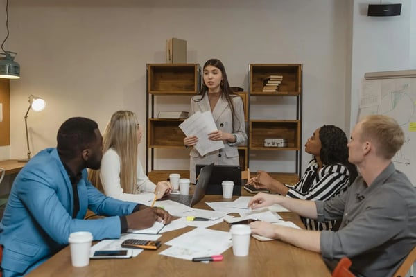 Leader giving presentation to his employees