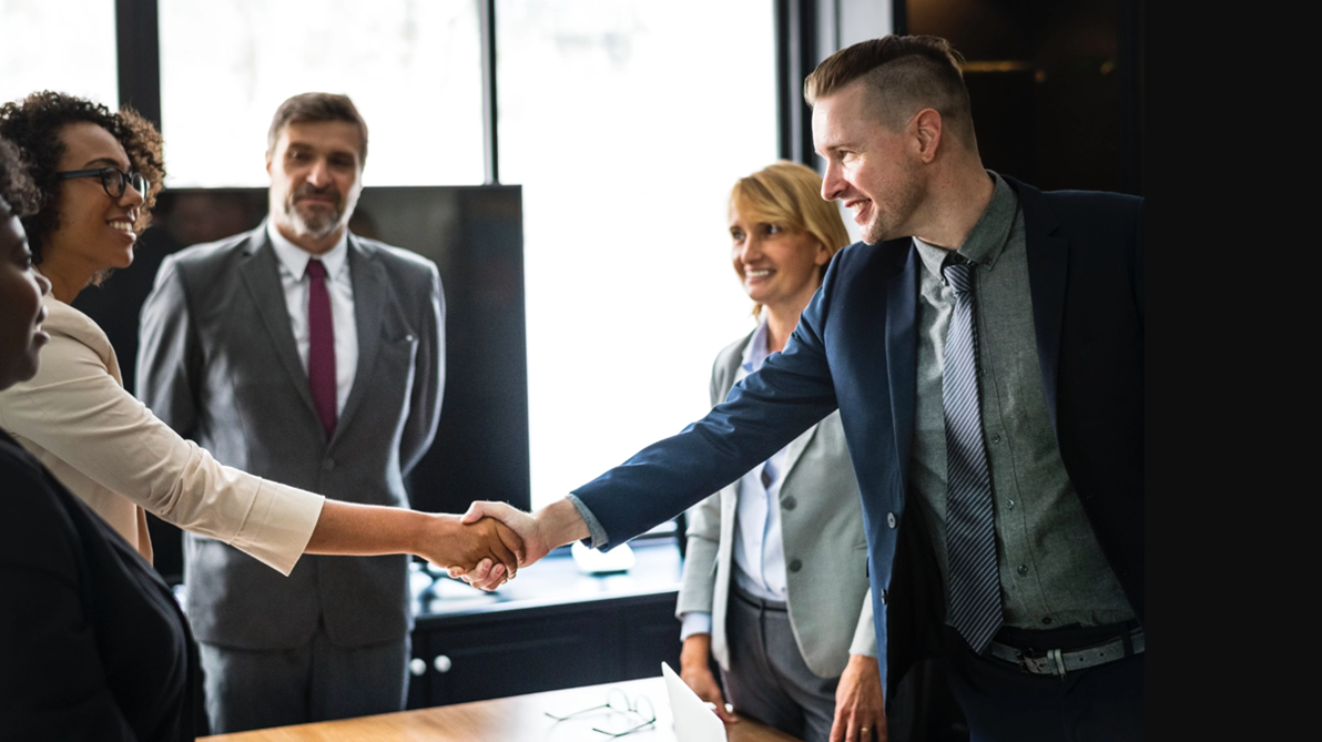 Sales representatives closing a deal