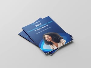 E blue E book mockup shows Retorio- 2024 Leadership Training Trends 7 must-knows cover