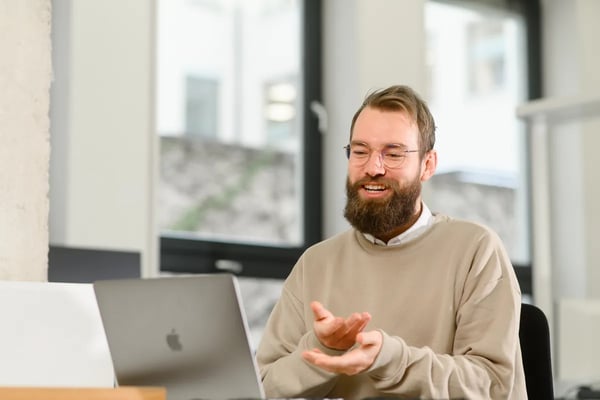 A man sitting at a table training his soft sales skills