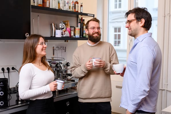 Retorio-Three people chatting over a coffee