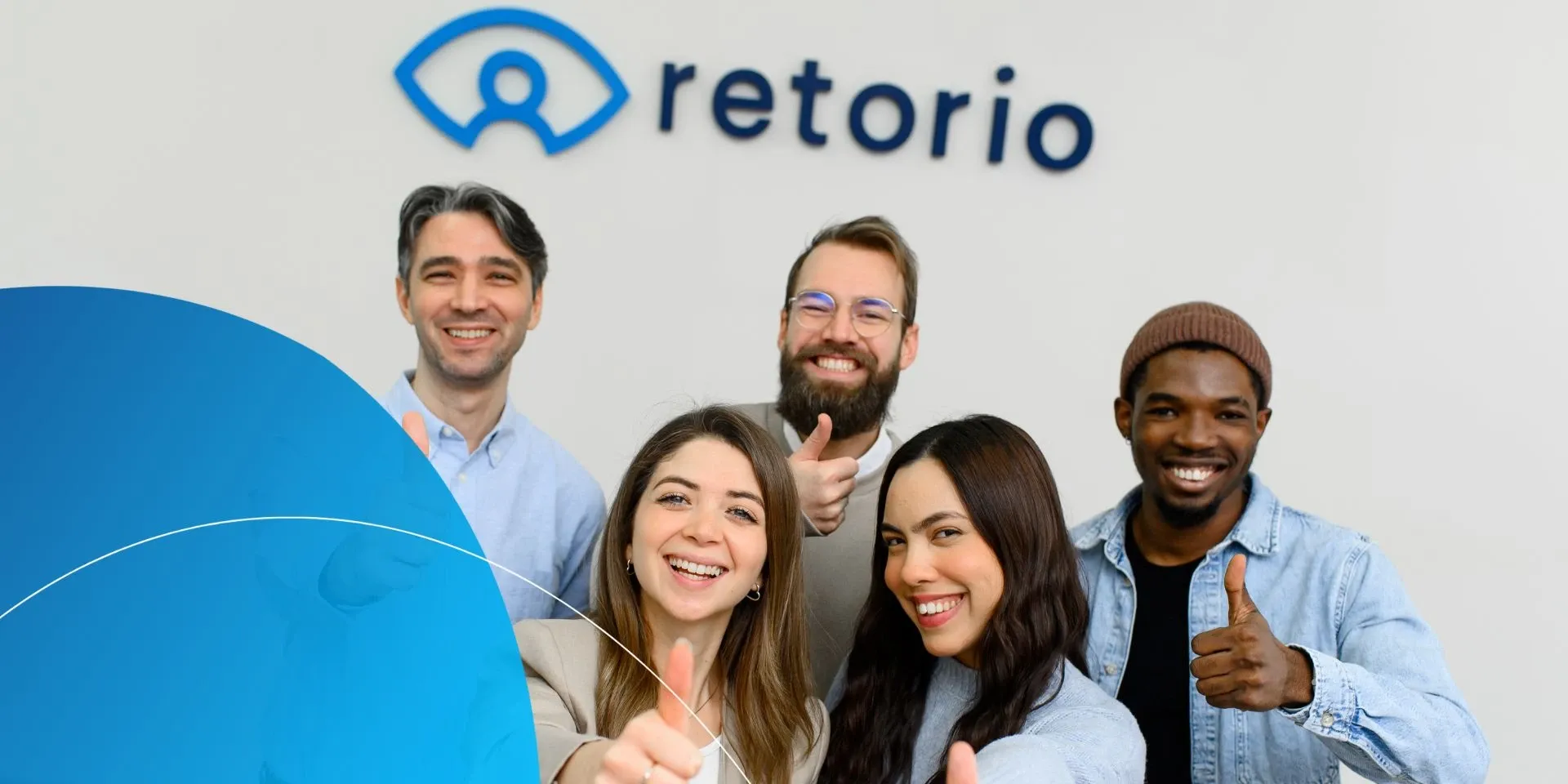 4 people standing and giving thumbs up to camera 
