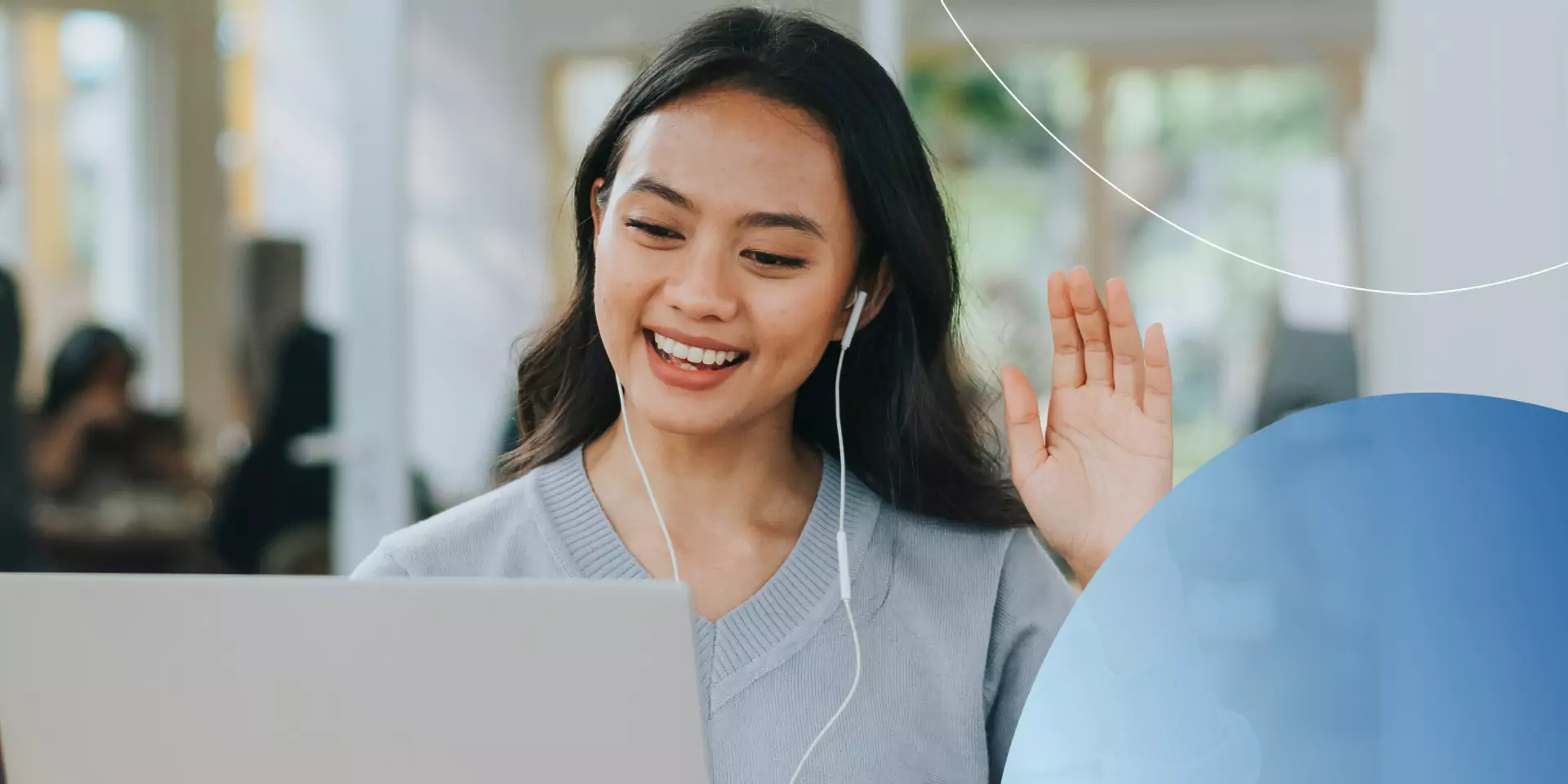 Retorio 10 Essential Soft Skills to Succeed in Customer Service woman wearing earphones waving into laptop