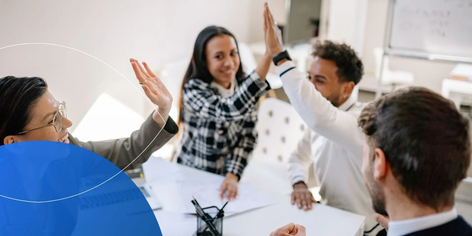 woman high fiving a man with two other people around them