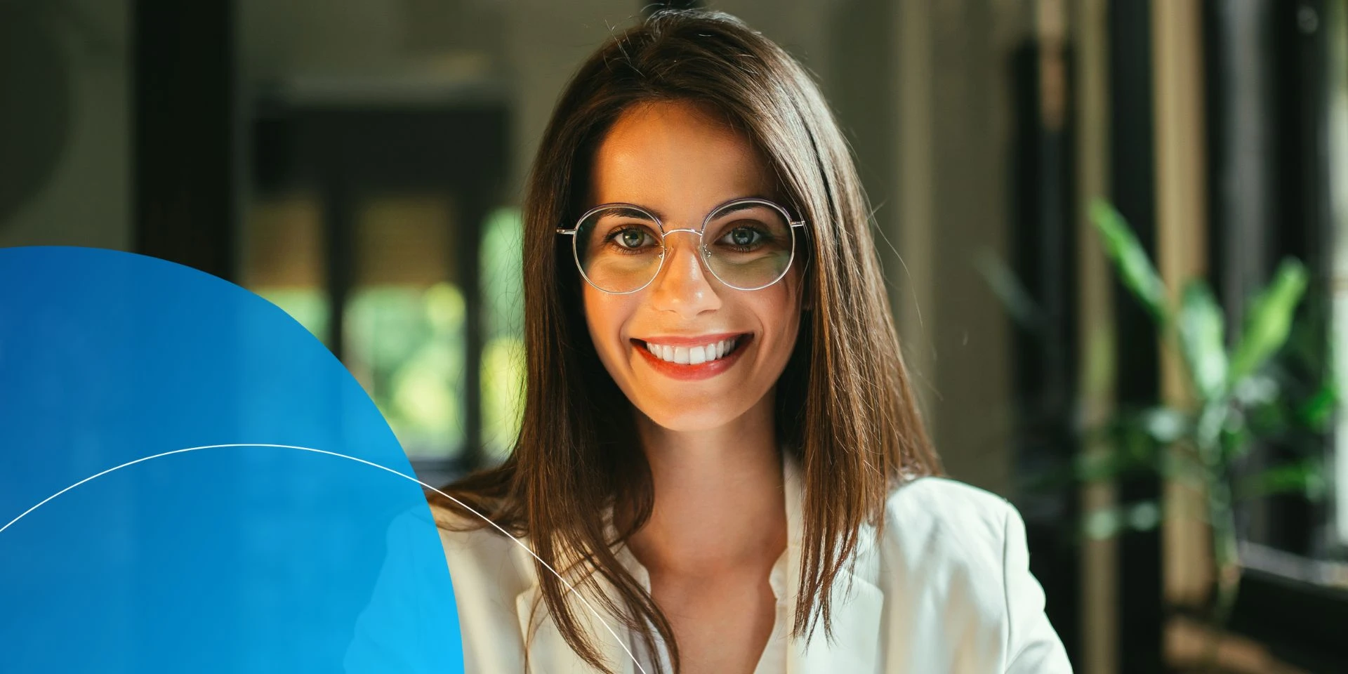 woman wearing glasses smiling into camera