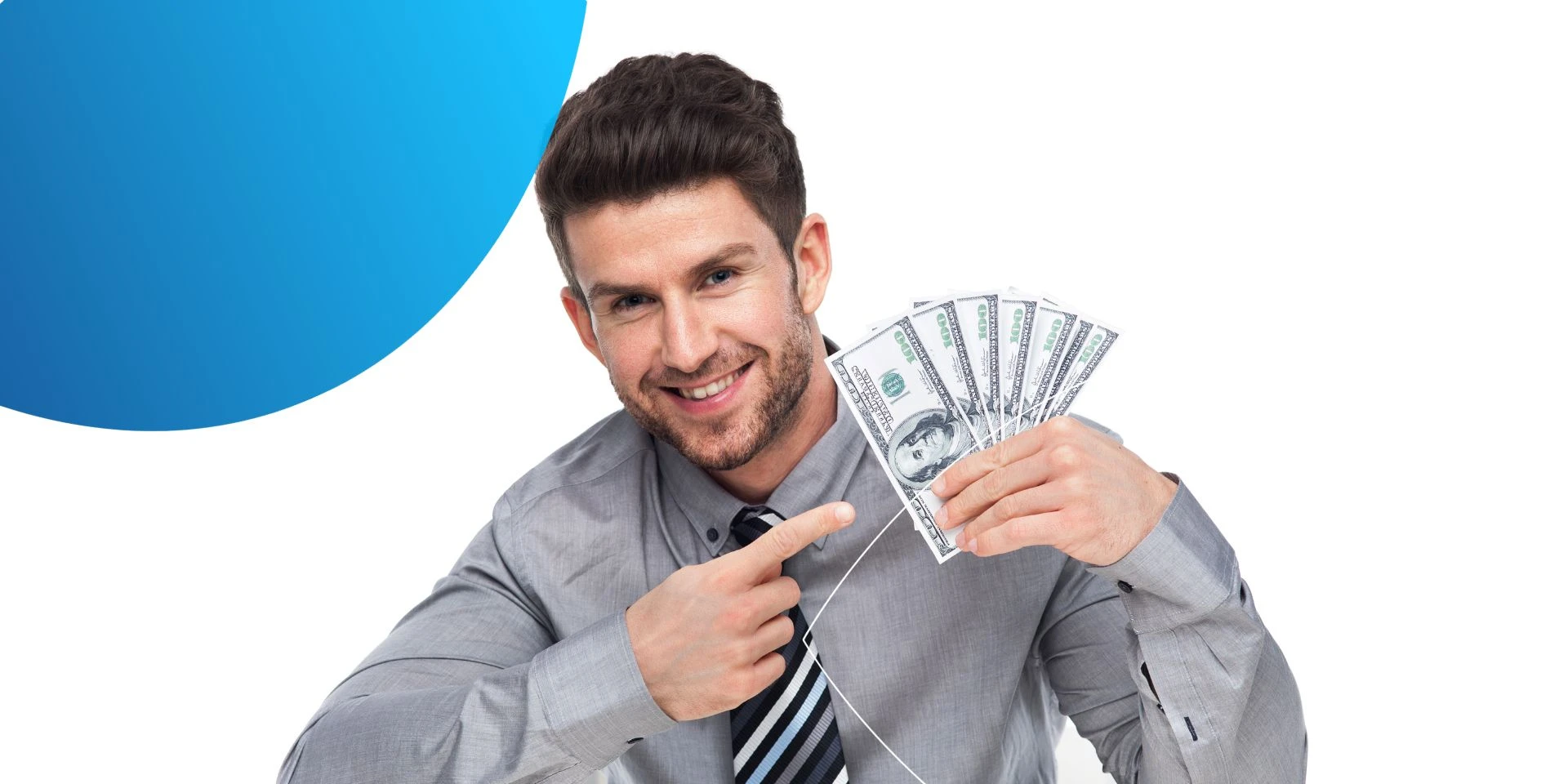 Man holding dollar bills in one hand smiling at the camera 